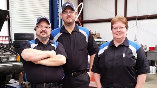 The Wolfsburg Tech crew standing in the shop.
