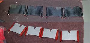 Intake port plates, carboned-up above and cleaned below.