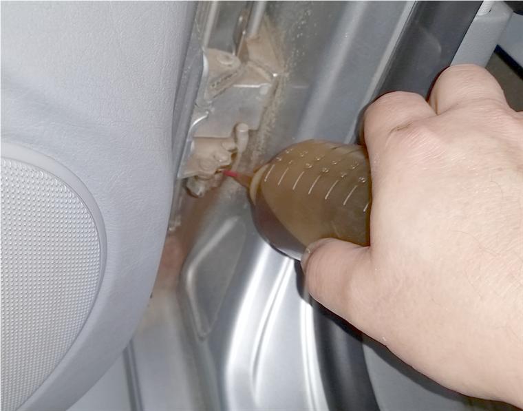 Lubing the door detent rollers.