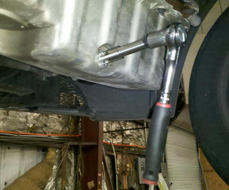 Drilled oversize and tapping with the Helicoil tap. A perfect angle is required for the washer to seal.